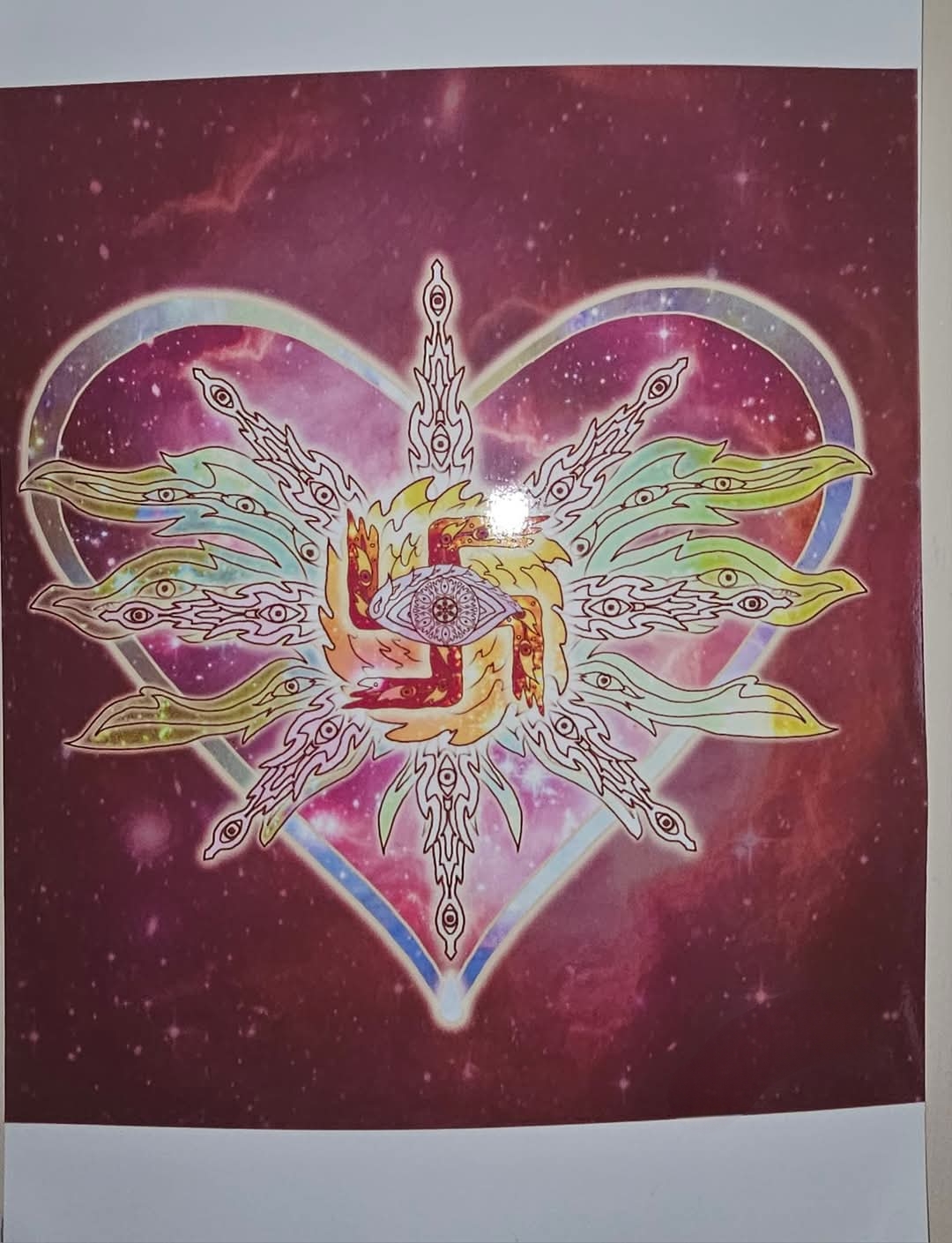 Digital drawing of a glowing heart on a dark starfield, holding a many-eyed, many-winged figure of light whose centre is a large eye set over a flaming hooked cross.